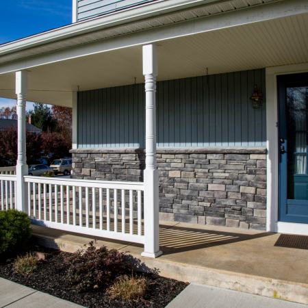 Weatcher - stone wall siding on front porch