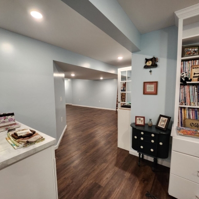 Thomas after - finished basement craft room to hallway