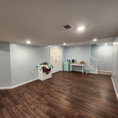 Thomas after - finished basement room and stairs