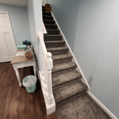 Thomas after - finished basement stairs